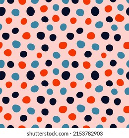 Colorful spots seamless pattern with pink background.