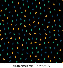 Colorful sprinkles seamless pattern with black  background.