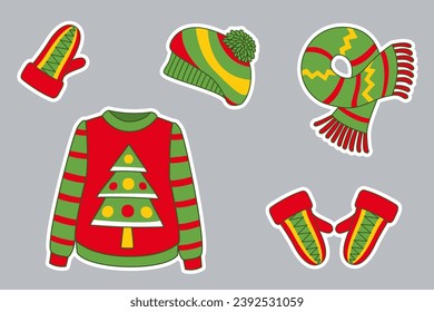 Colorful sticker set of winter clothes.  Beret, scarf, mittens, sweater with Christmas tree.