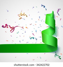 Colorful streamers with confetti. Green curved ribbon, on celebration background with colorful confetti and ribbons. New year and xmass background