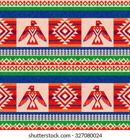 Colorful striped textile ethnic pattern with stylized eagle svg