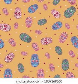 Colorful sugar skulls seamless vector pattern. Day of the dead and halloween surface print design for fabrics, stationery, scrapbook paper, packaging, gift wrap, and backgrounds.