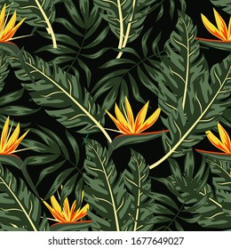 Colorful summer seamless pattern. Tropical plants, leaves and flowers on a dark background. Trendy summer Hawaii print. Floral pattern. Exotic wallpaper, Jungle leaves.