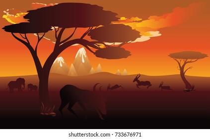 Colorful sunset scene, african landscape with silhouette of trees and antelopes.
