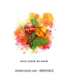 Colorful tropical Happy Fifth May card or poster design with a sunburst over red and orange musical rattles on an abstract geometric hexagonal pattern with Mexican text on white below