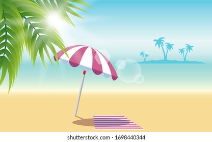 colorful umbrella and beach mat on the beach in summer