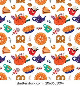 Colorful various autumn pastry and drinks amidst leaves forming seamless pattern on white background
