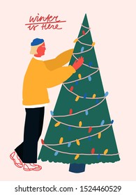 Colorful vector illustration dedicated to Christmas and New Year. Winter Is Here festive lettering. Young boy decorates a christmas tree.