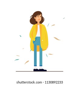 Colorful vector illustration standing happy young woman wearing a yellow coat. Flat cartoon hipster characters isolated on white background. Autumn mood