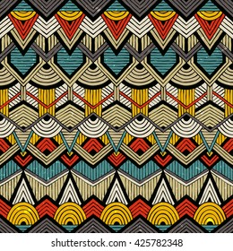 Colorful vector pattern in tribal style. Seamless hand-drawn background with grunge texture. EPS10.