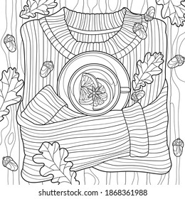 Coloring book for adults. Black and white graphics.  A mug of warm tea with lemon on a sweater surrounded by autumn leaves