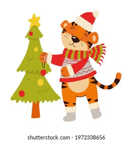 Coloring book with an example for children where a tiger decorates a Christmas tree. Amur tiger in a red hat and scarf.