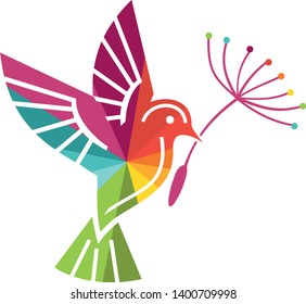 Coloured bird in flight with a flower in its beak