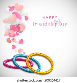 Colourful bands on heart shape decorated grey background for Happy Friendship Day celebrations. 