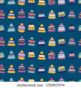 Colourful bobble winter hats on blue background. Great for home decor, wrapping, scrapbooking, wallpaper, gift, kids. 