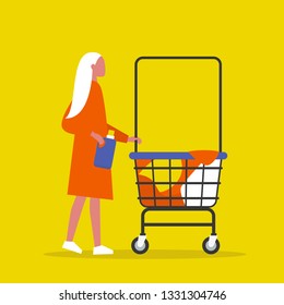 Colourful clothes in a trolley. Self service. Young female character rolling a laundry cart. Laundromat. Detergent. Daily chores concept.