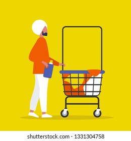 Colourful clothes in a trolley. Self service. Young indian male character rolling a laundry cart. Laundromat. Detergent. Daily chores concept.