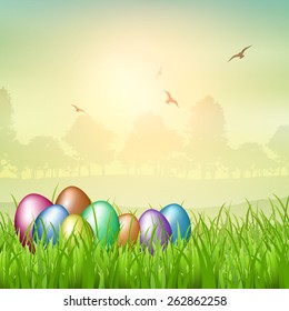 Colourful Easter eggs nestled in grass