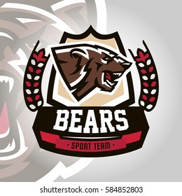 Colourful emblem, logo, snarling and ready to attack bear, grizzly, dangerous predator, the dweller forest. Vector illustration, dynamic and sporty style, printing on T-shirts 