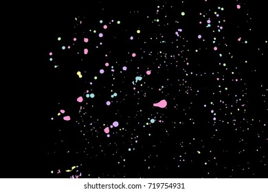 Colourful explosion of confetti. Grainy glitter and sprinkles. Abstract holiday illustration. Isolated on black background. Abstract textured isolated on white background. Vector.