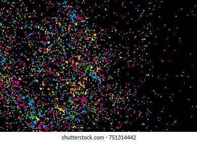 Colourful explosion of confetti. Grainy glitter and sprinkles. Abstract holiday illustration. Isolated on black background. Abstract textured isolated on white background. Vector