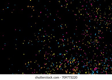 Colourful explosion of confetti. Grainy textured birthday design for greeting cards and posters, glitter design template for birthday and holidays visuals. Vector.