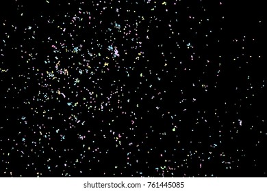 Colourful explosion of confetti. Grainy textured birthday design for greeting cards and posters, glitter design template for birthday and holidays visuals. Vector.