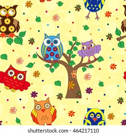 Colourful funny owls on yellow background, seamless cartoon vector pattern
