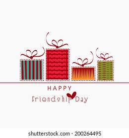 Colourful gift boxes on white background for Happy Friendship Day celebrations. 