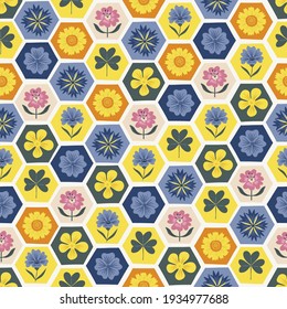 Colourful honeycomb flower tiled vector seamless pattern. Floral hexagonal mosaic tessellated ornament. Decorative meadow honeycomb tile with folksy wildflower surface print design