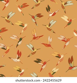 Colourful hummingbird on Indian yellow background. Seamless pattern. For textile, wallpaper, packaging, DIY projects.