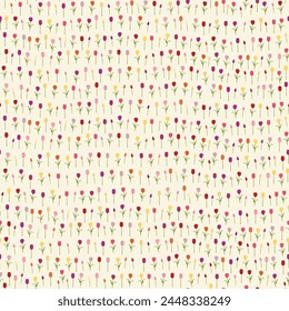 Colourful Spring tulips scattered on a light yellow background vector repeat pattern
