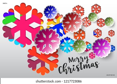 Colours paper cut of vector snowflake on gradient colours ornate background with merry christmas phase text