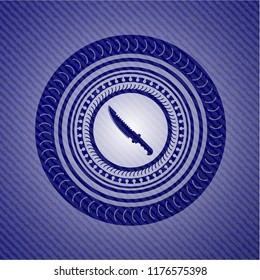 combat knife icon inside badge with jean texture