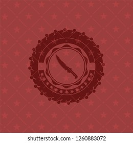 combat knife icon inside badge with red background