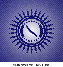 combat knife icon inside badge with jean texture