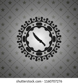 combat knife icon inside black badge