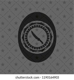 combat knife icon inside black emblem