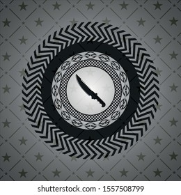 combat knife icon inside black badge