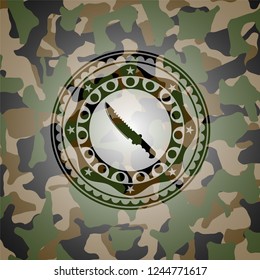 combat knife icon inside camo emblem