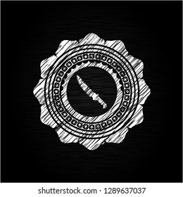 combat knife icon inside chalkboard emblem on black board