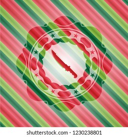 combat knife icon inside christmas colors badge.