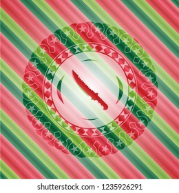 combat knife icon inside christmas style badge..