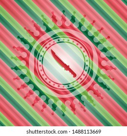 combat knife icon inside christmas colors emblem.