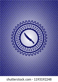 combat knife icon inside denim background