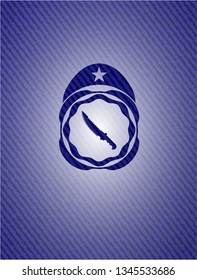 combat knife icon inside denim background