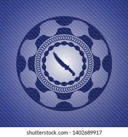 combat knife icon inside denim background