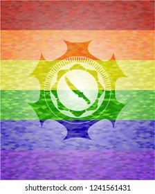 combat knife icon inside emblem on mosaic background with the colors of the LGBT flag