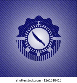 combat knife icon inside emblem with jean high quality background