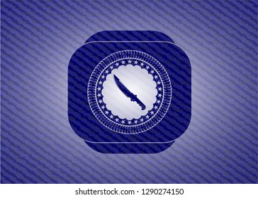 combat knife icon inside emblem with jean texture